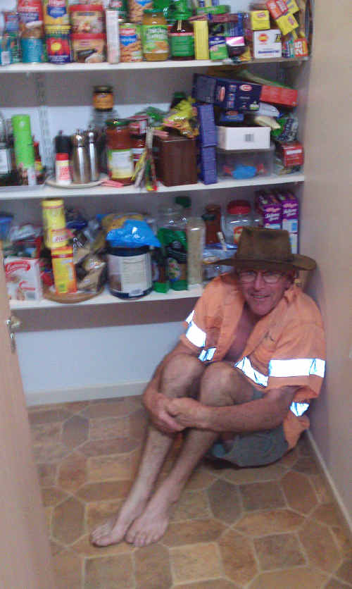 SAFE NOT SORRY: Tom Dunbar jokingly hides in the pantry in preparation. cont SAFE NOT SORRY: Tom Dunbar jokingly hides in the pantry in preparation. cont